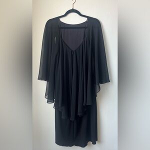 Calvin Klein Black Dress with sheer cape over the shoulder.